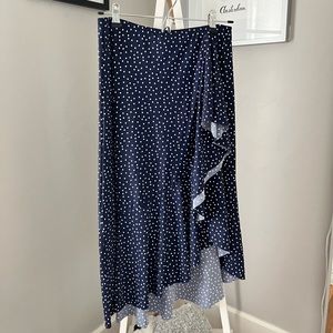 Navy with white polka dot ruffled swim skirt.
